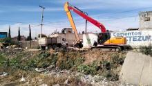 Hallan restos humanos en canal de aguas negras de Ecatepec